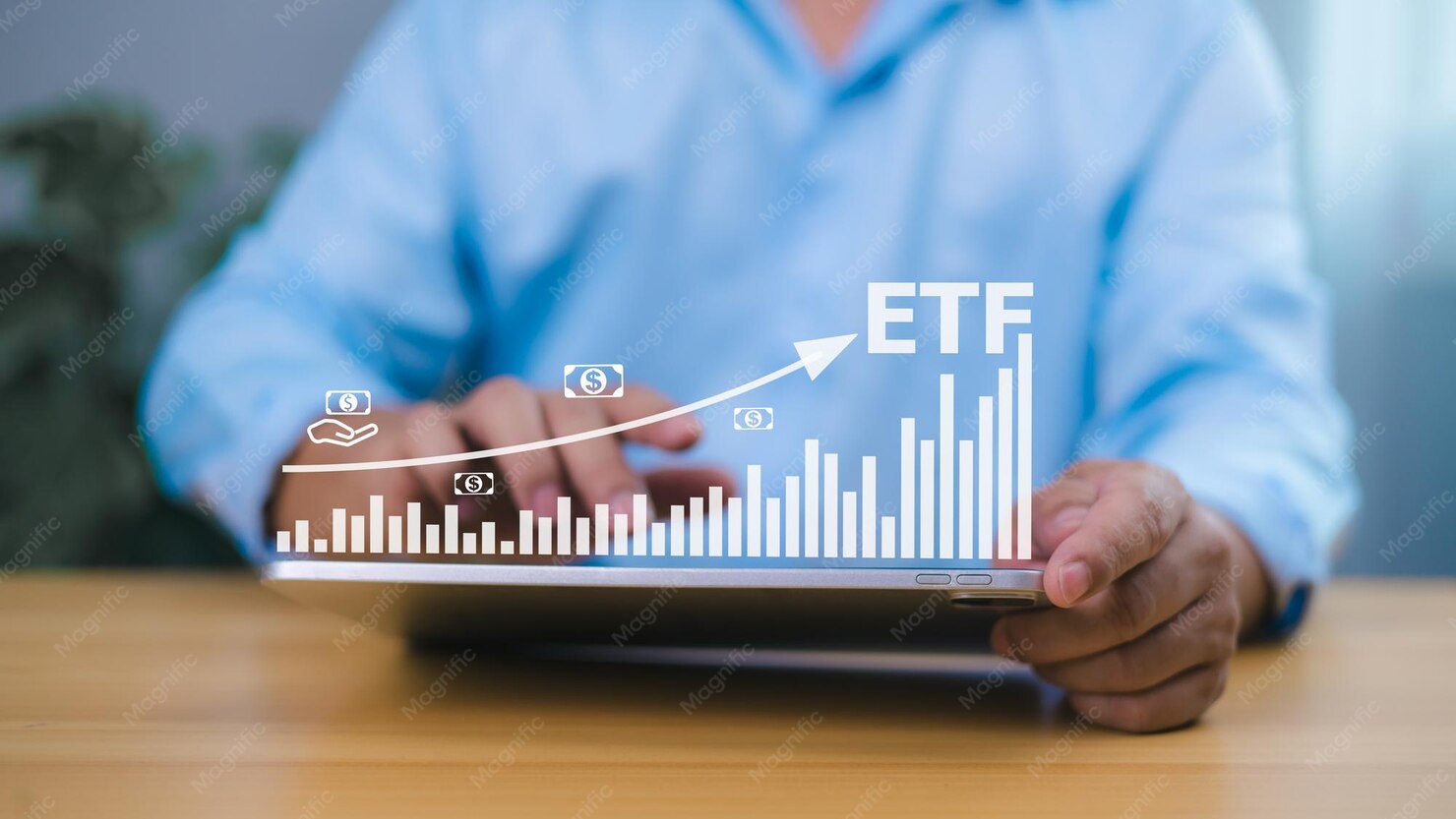 Investor using tablet to analyze etf growth chart representing ...